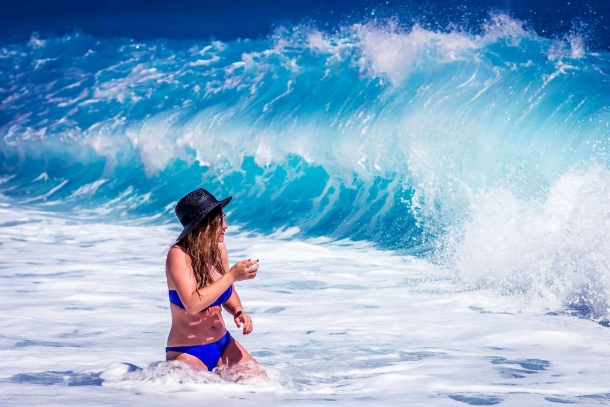 Woman in surf in the waves